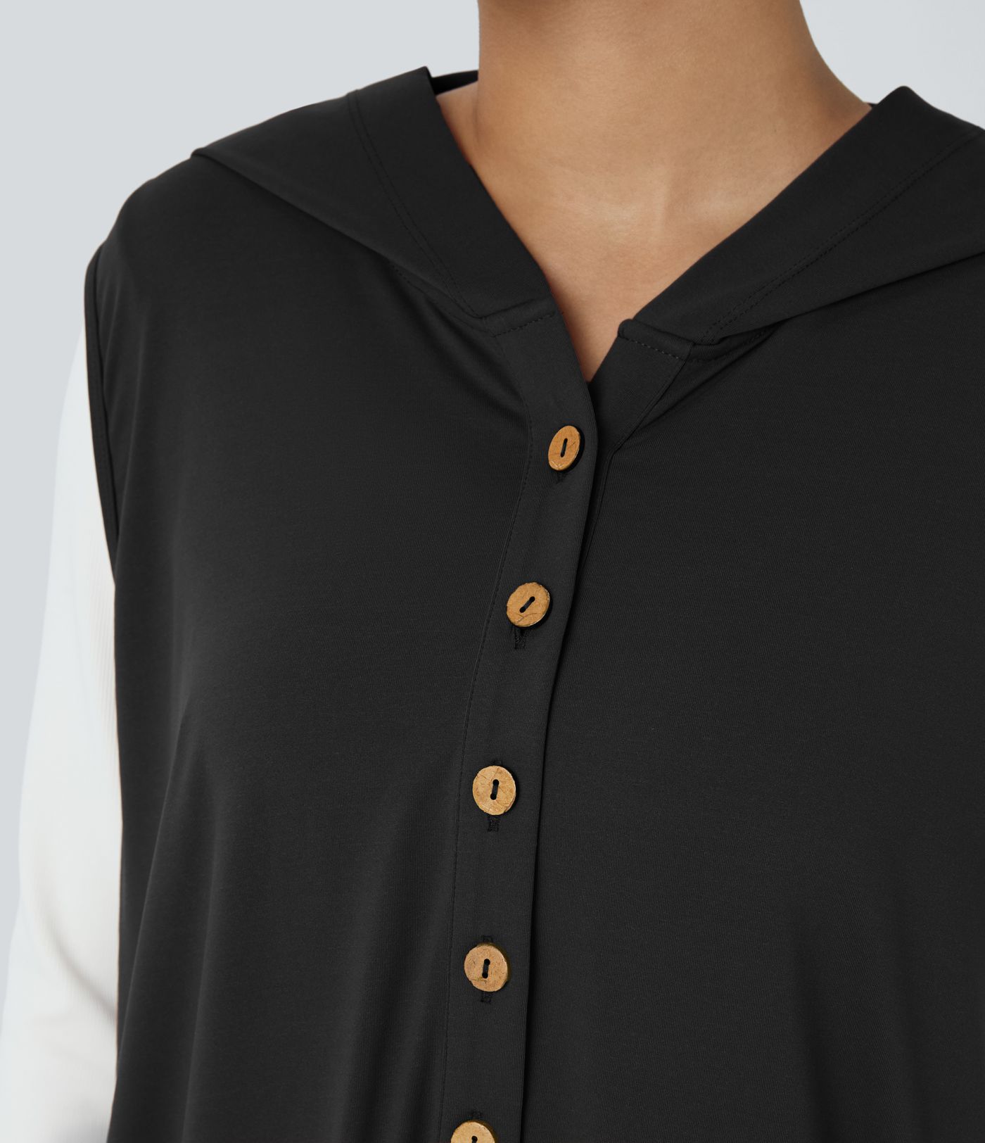 Mono jogger drapeado bolsillo lateral sin mangas botón capucha delantera