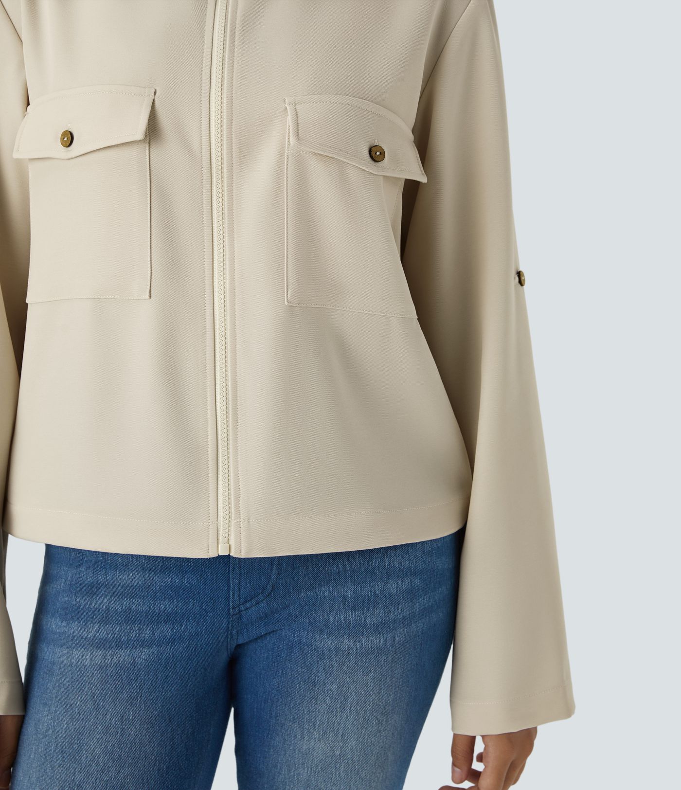 Stand collar Roll tab Sleeves Flap pocket Drawstring inside Hem zip Casual jacket