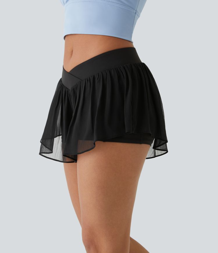 Pantalones cortos de yoga de tiro bajo con cruce, bolsillos y transparencia 2 en 1