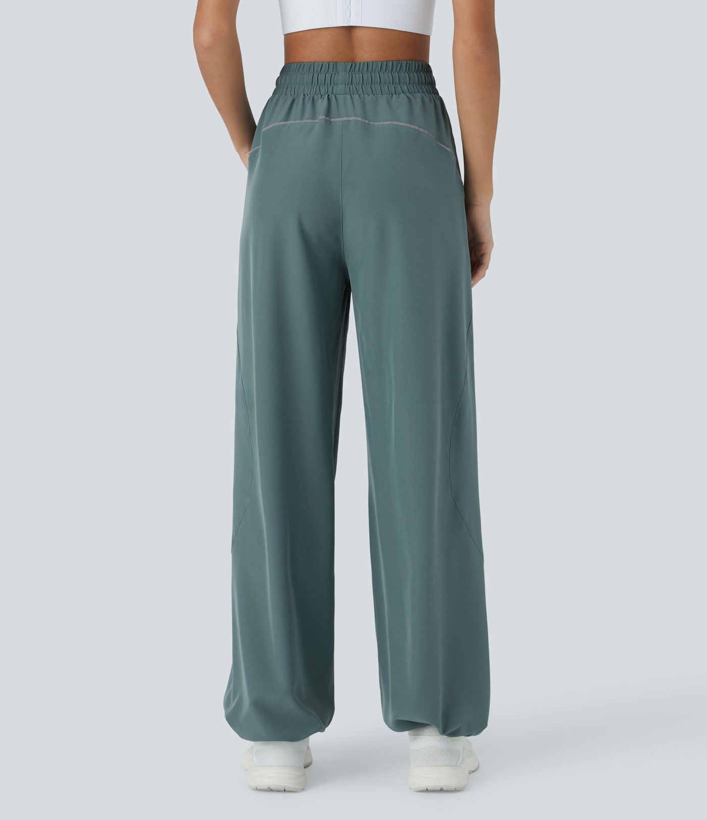 Pantalón correr tiro alto cordón ajustable bolsillo lateral dobladillo reflectante