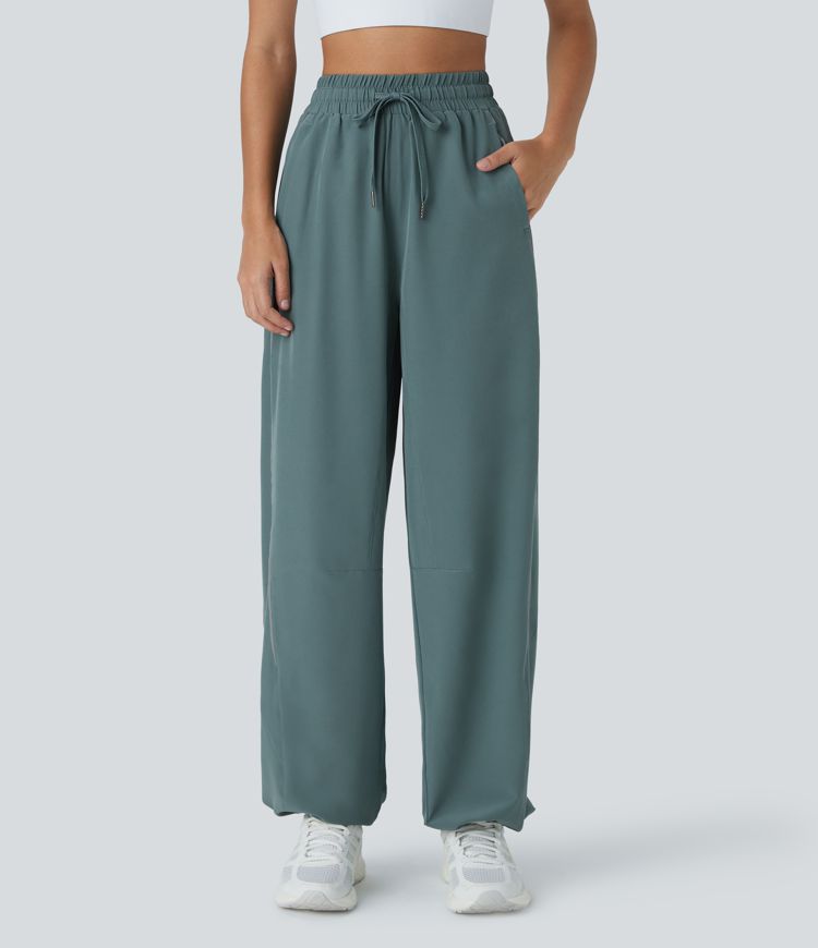 Pantalón correr tiro alto cordón ajustable bolsillo lateral dobladillo reflectante