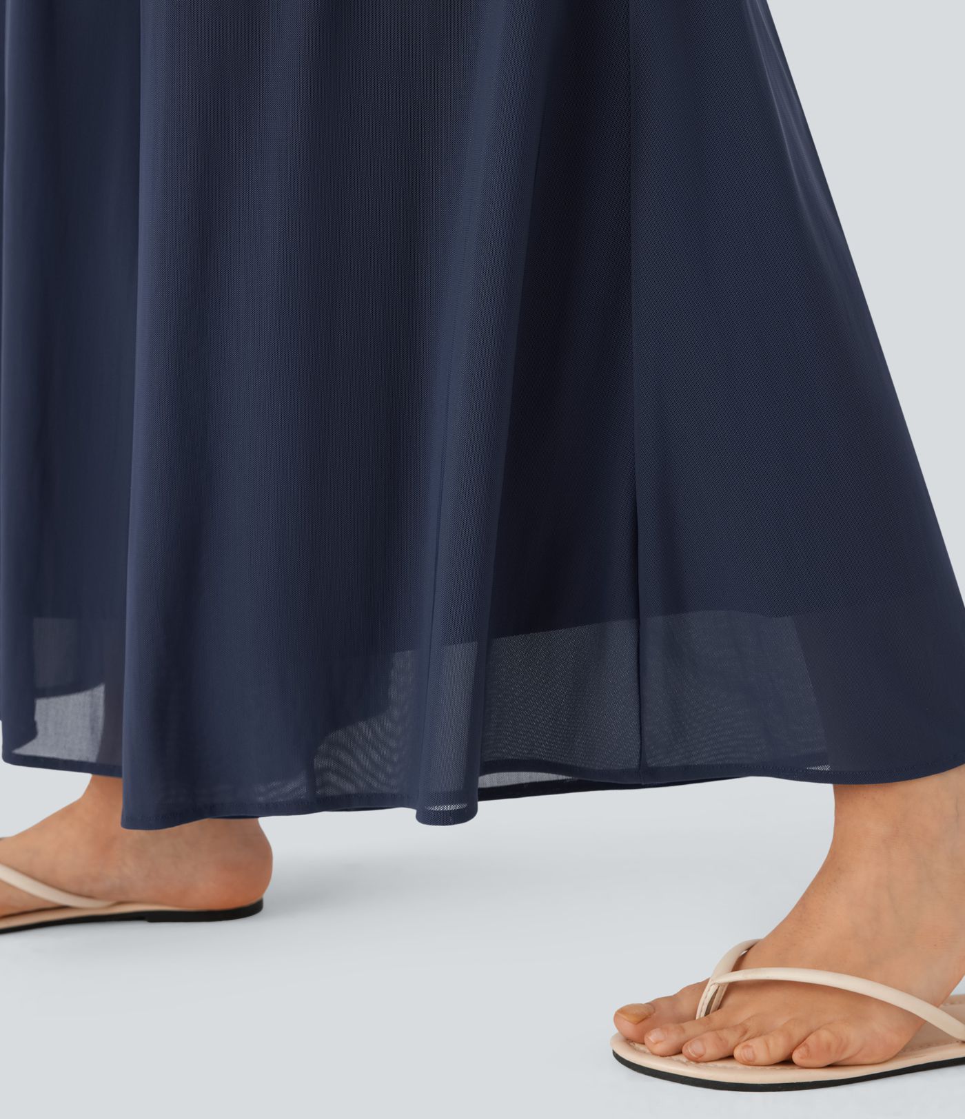 Pantalon fluide et ample avec superposition en mesh, poches latérales et taille haute