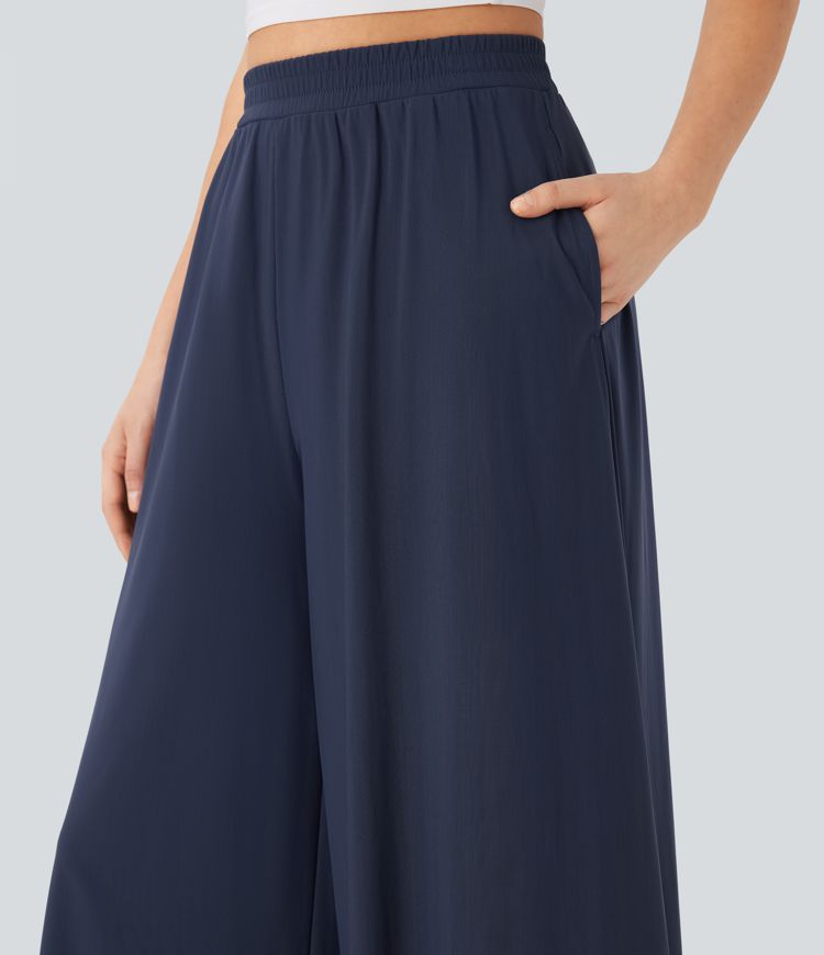 Pantalon fluide et ample avec superposition en mesh, poches latérales et taille haute