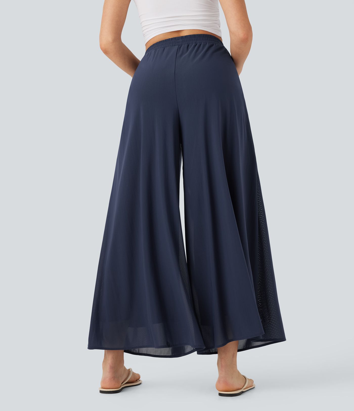 Pantalon fluide et ample avec superposition en mesh, poches latérales et taille haute