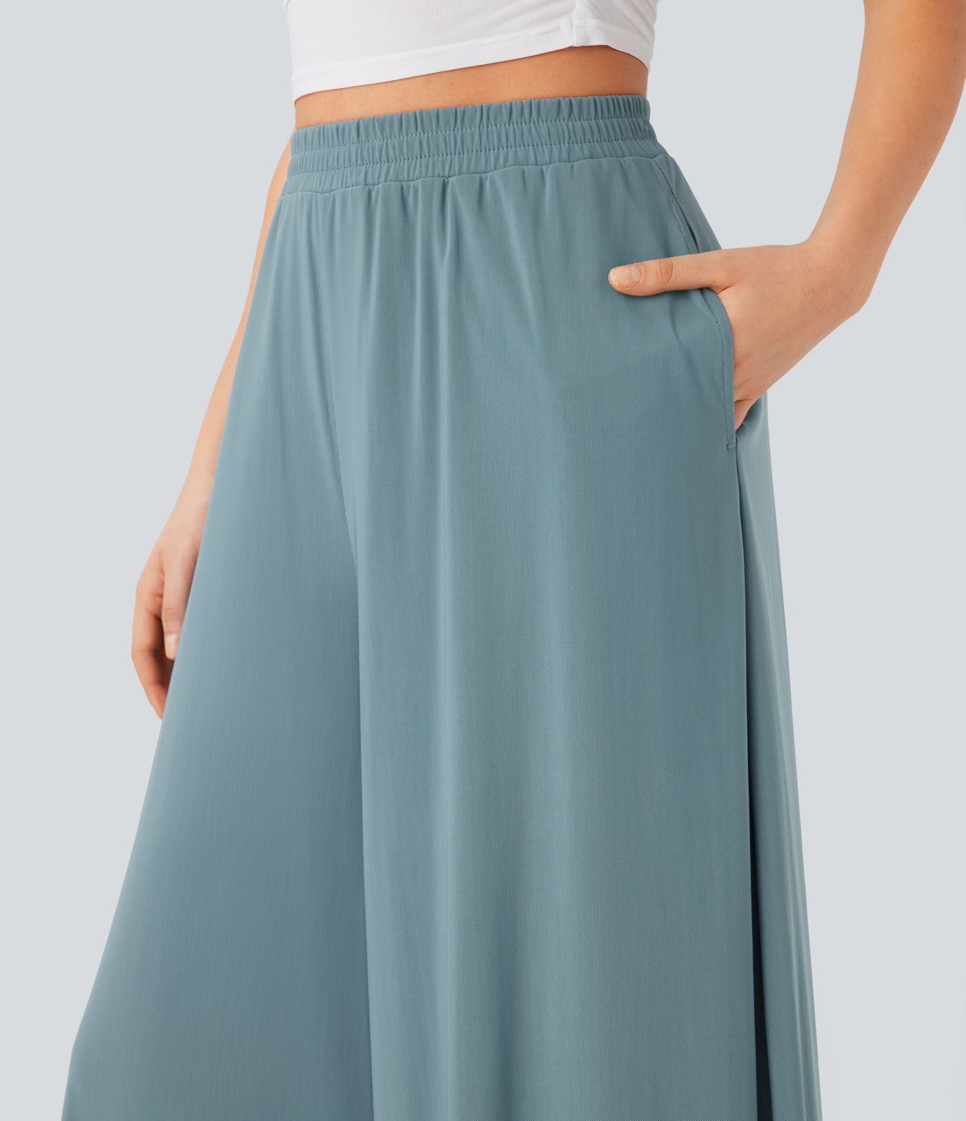 Freizeithose mit hohem Bund, Seitentaschen, kontrastierendem Netzstoff und weitem Bein