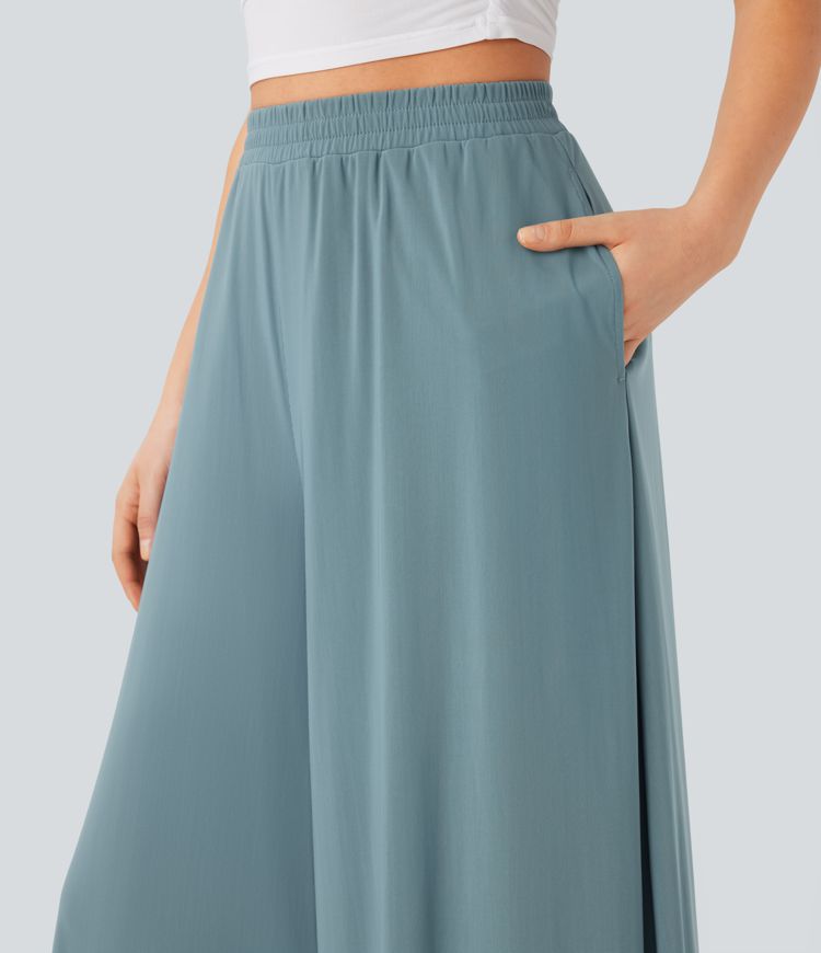 Freizeithose mit hohem Bund, Seitentaschen, kontrastierendem Netzstoff und weitem Bein