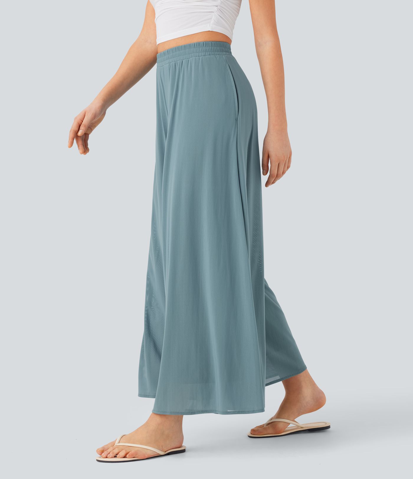 Freizeithose mit hohem Bund, Seitentaschen, kontrastierendem Netzstoff und weitem Bein