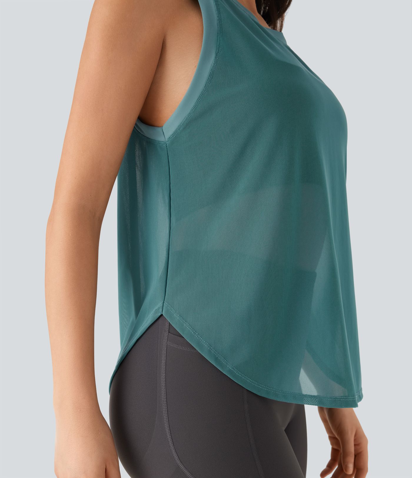 Haut de sport transparent pour yoga sans manches avec ourlet courbé