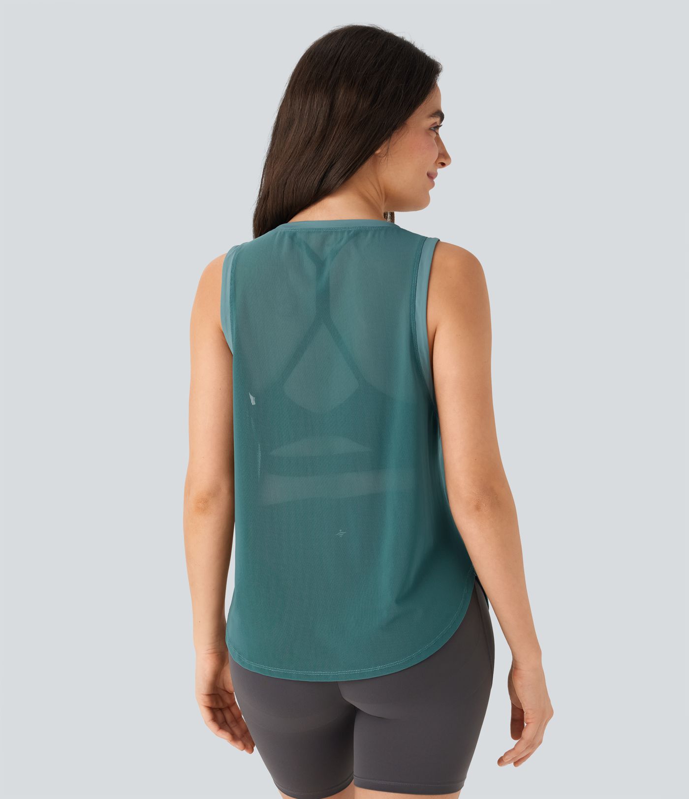 Haut de sport transparent pour yoga sans manches avec ourlet courbé