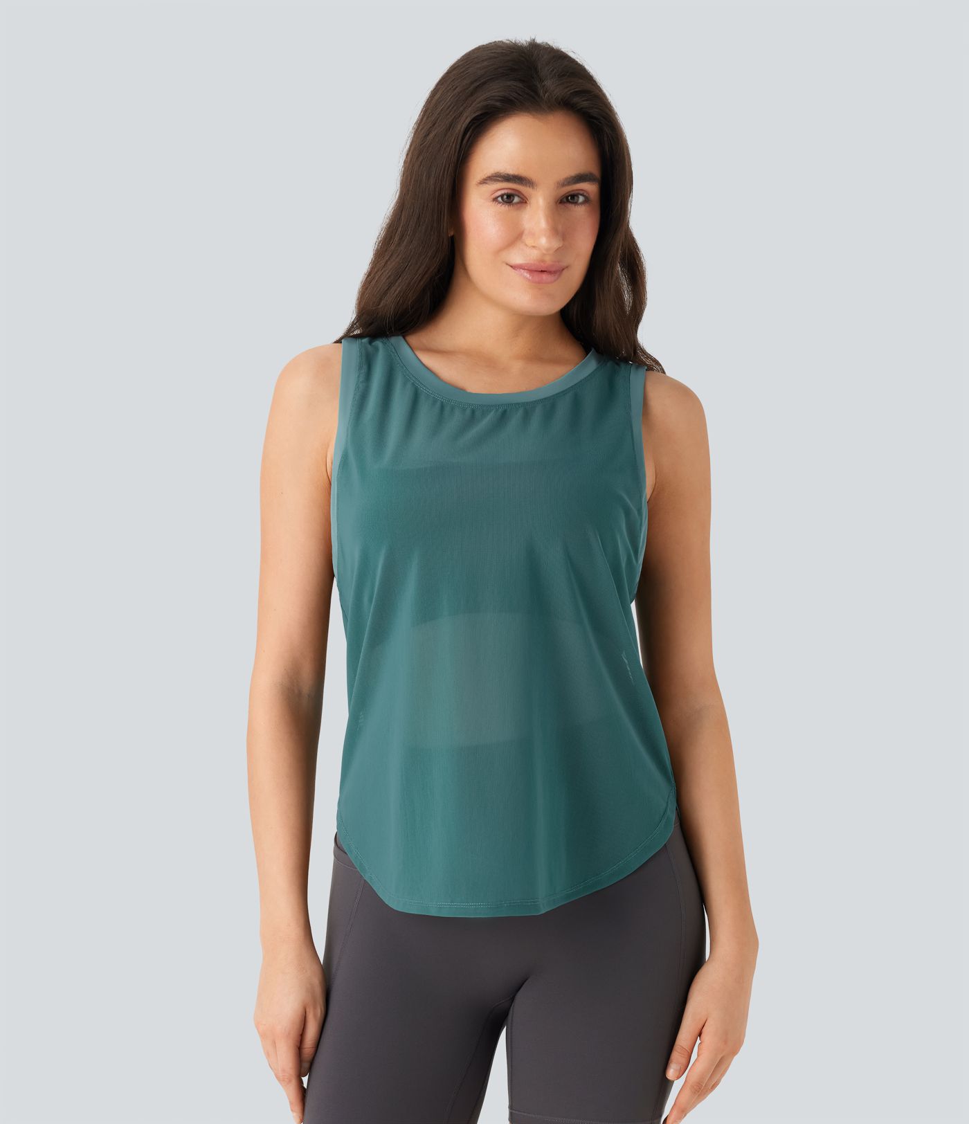 Haut de sport transparent pour yoga sans manches avec ourlet courbé