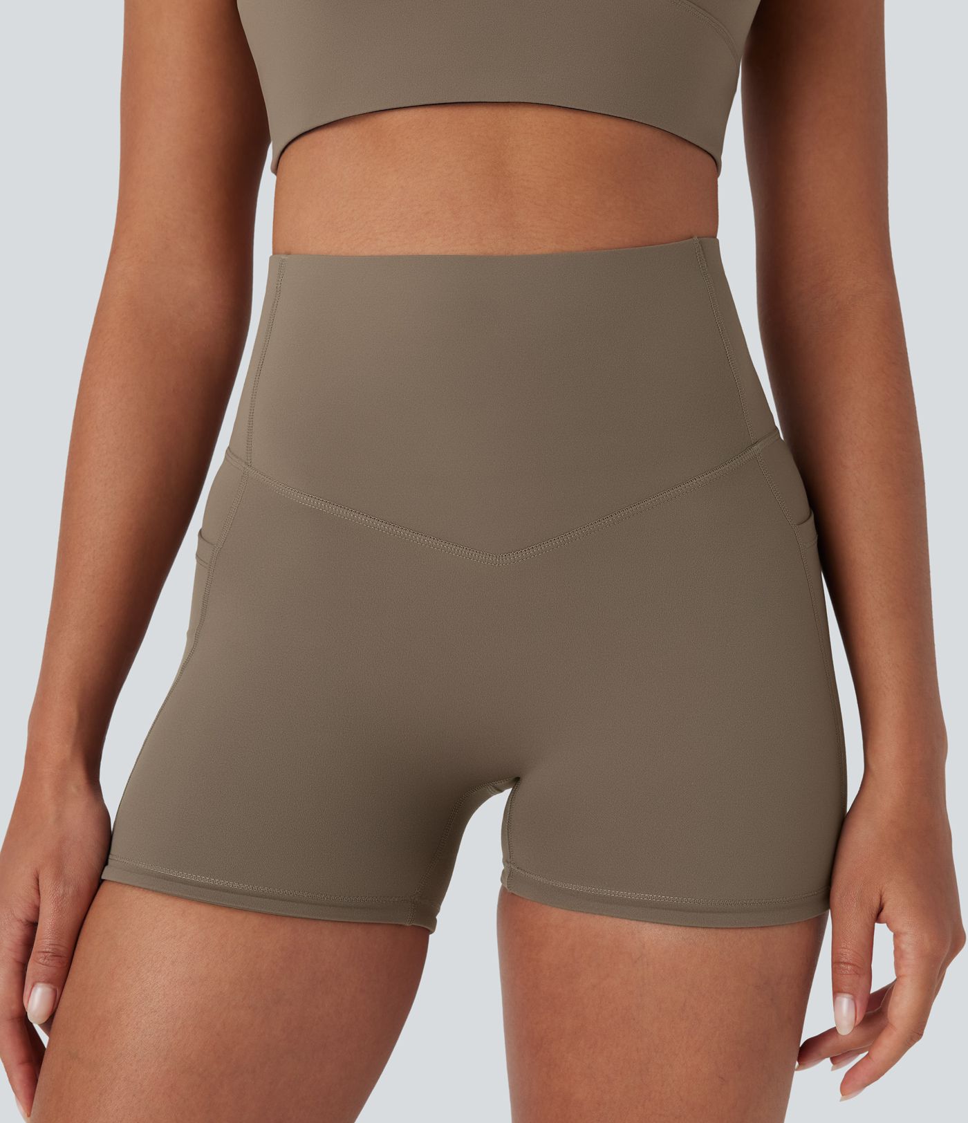 Shorts biker Halara UltraSculpt™ de tiro alto con push-up y reductor de abdomen con bolsillos laterales