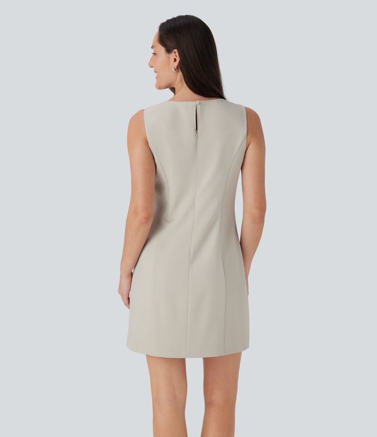 Robe de travail mini à encolure bateau sans manches avec bouton, fermeture éclair invisible et poches