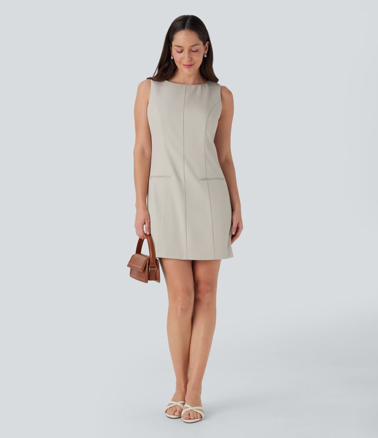 Robe de travail mini à encolure bateau sans manches avec bouton, fermeture éclair invisible et poches