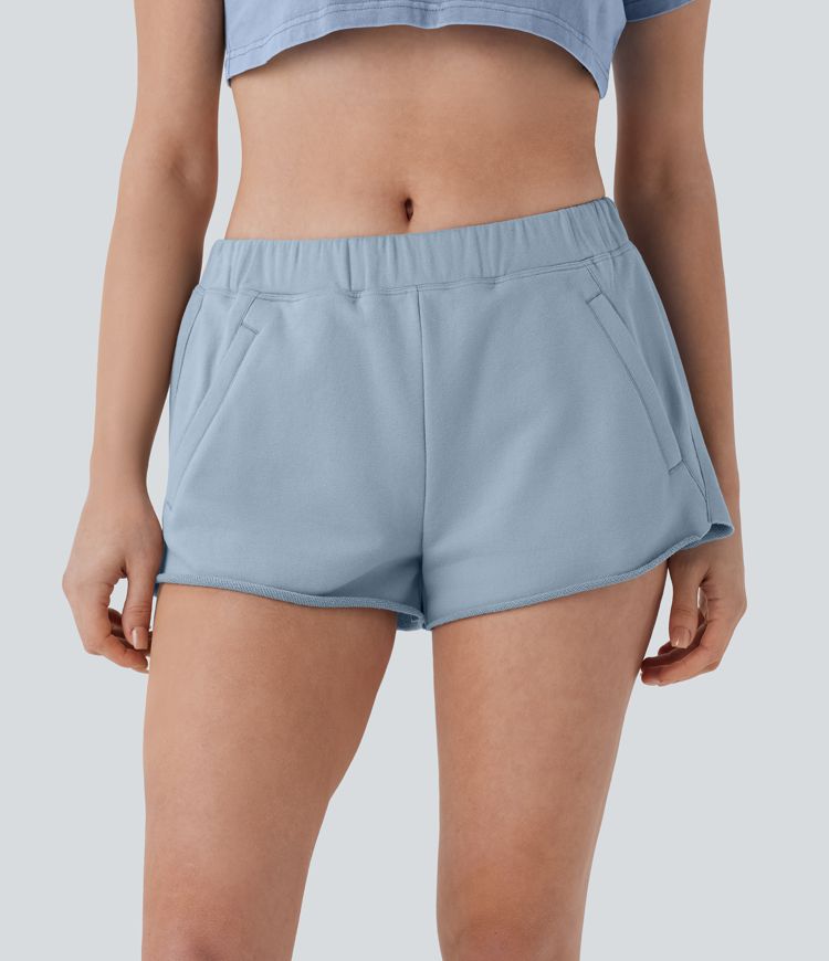 Short de yoga en coton taille mi-haute à poches zippées et ourlet brut