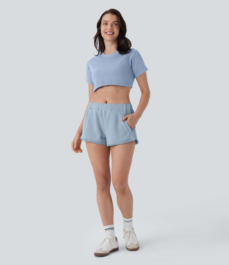 Short de yoga en coton taille mi-haute à poches zippées et ourlet brut