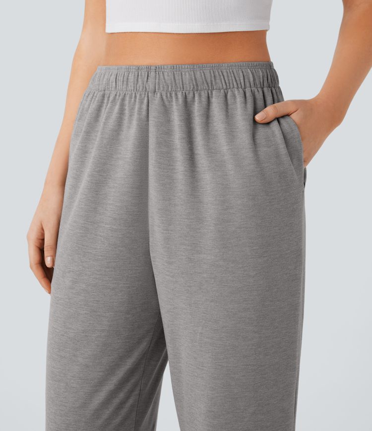 Pantalón tiro alto bolsillo lateral pierna recta dobladillo cordón