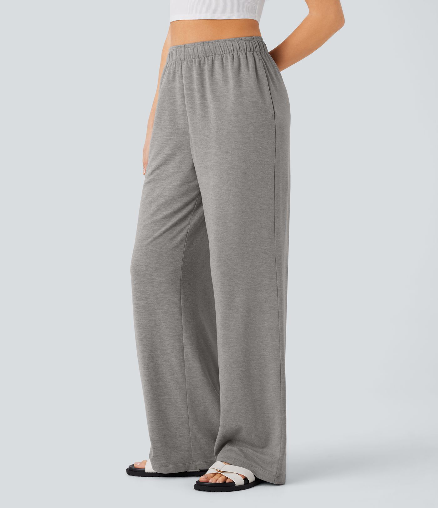 Pantalón tiro alto bolsillo lateral pierna recta dobladillo cordón