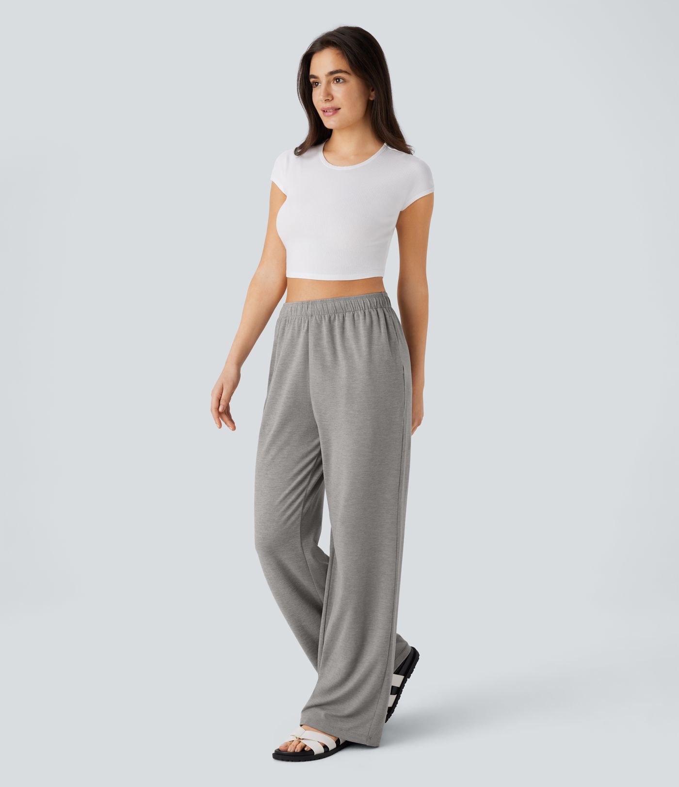 Pantalón tiro alto bolsillo lateral pierna recta dobladillo cordón