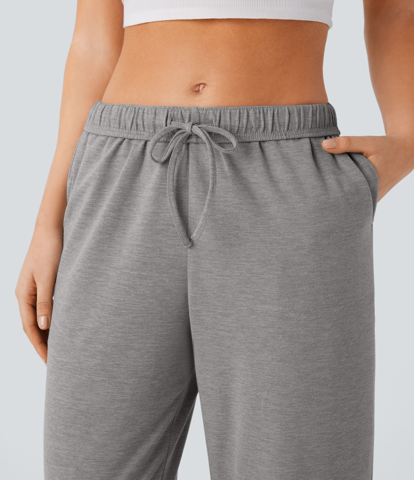 Pantalón tiro alto bolsillo lateral pierna recta dobladillo cordón