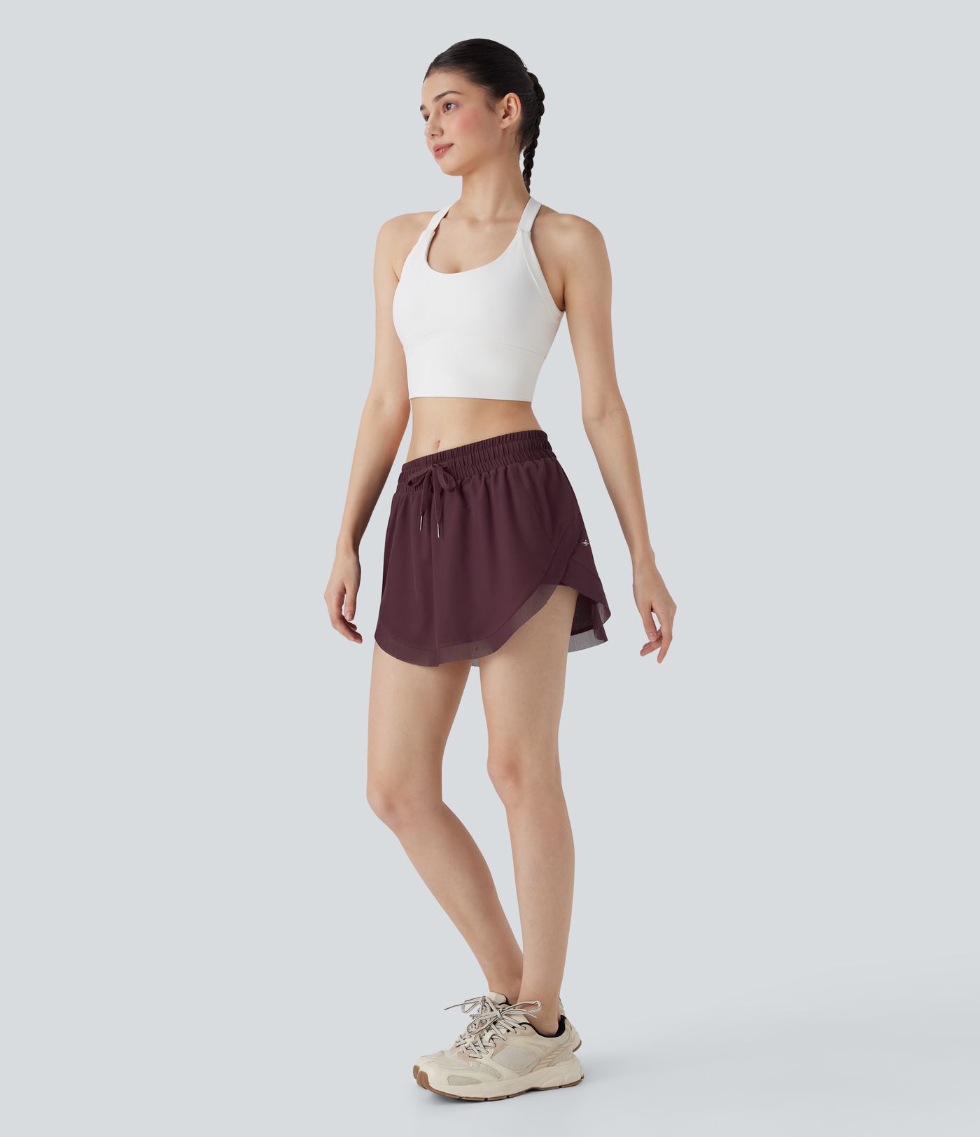 Mini-jupe de tennis 2-en-1 taille moyenne avec cordon de serrage, filet contrasté et poches latérales