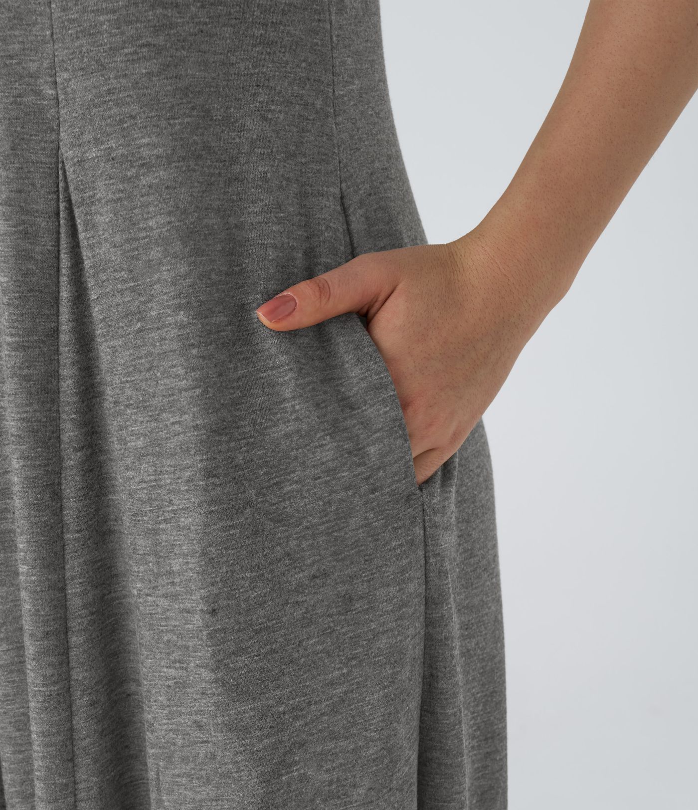 Mono drapeado bolsillo lateral cuello V