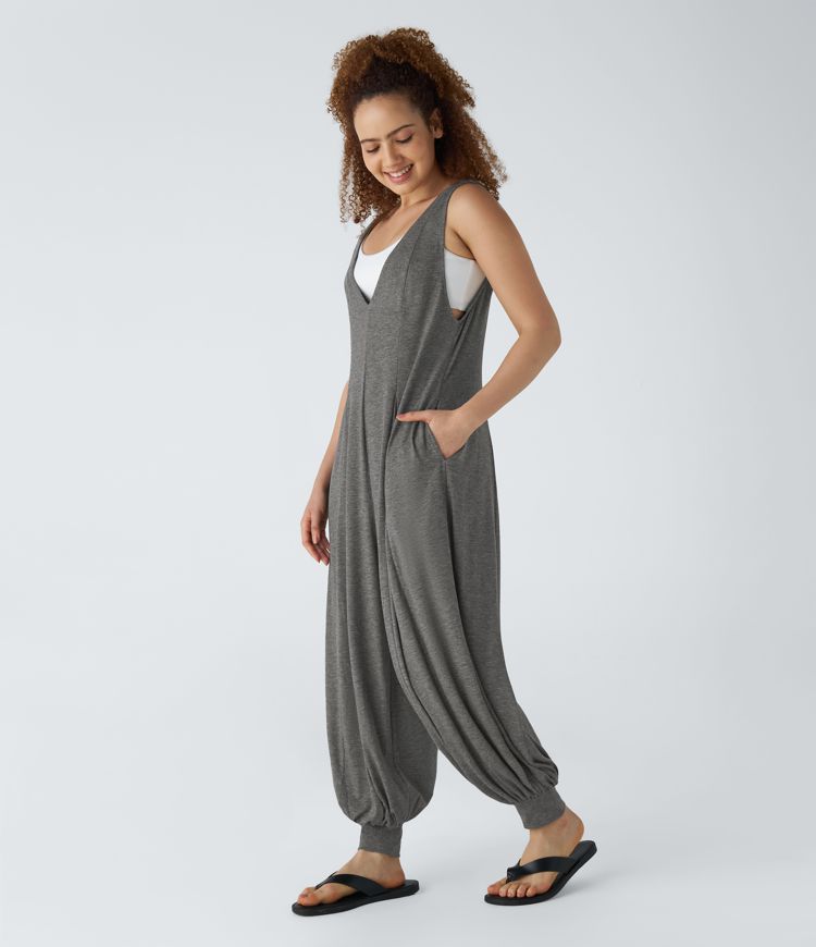 Mono drapeado bolsillo lateral cuello V