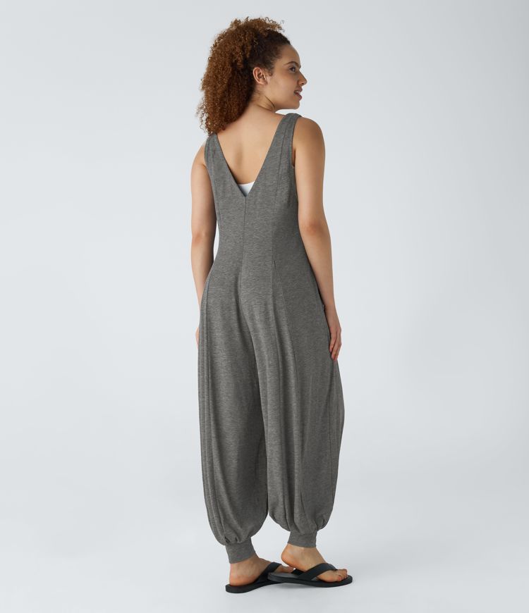 Mono drapeado bolsillo lateral cuello V