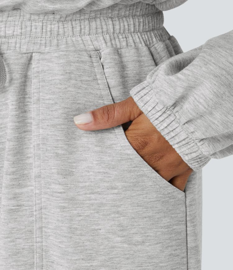 Combinaison décontractée col rond, fermoir en G au dos, manches longues, cordon de serrage et poches latérales