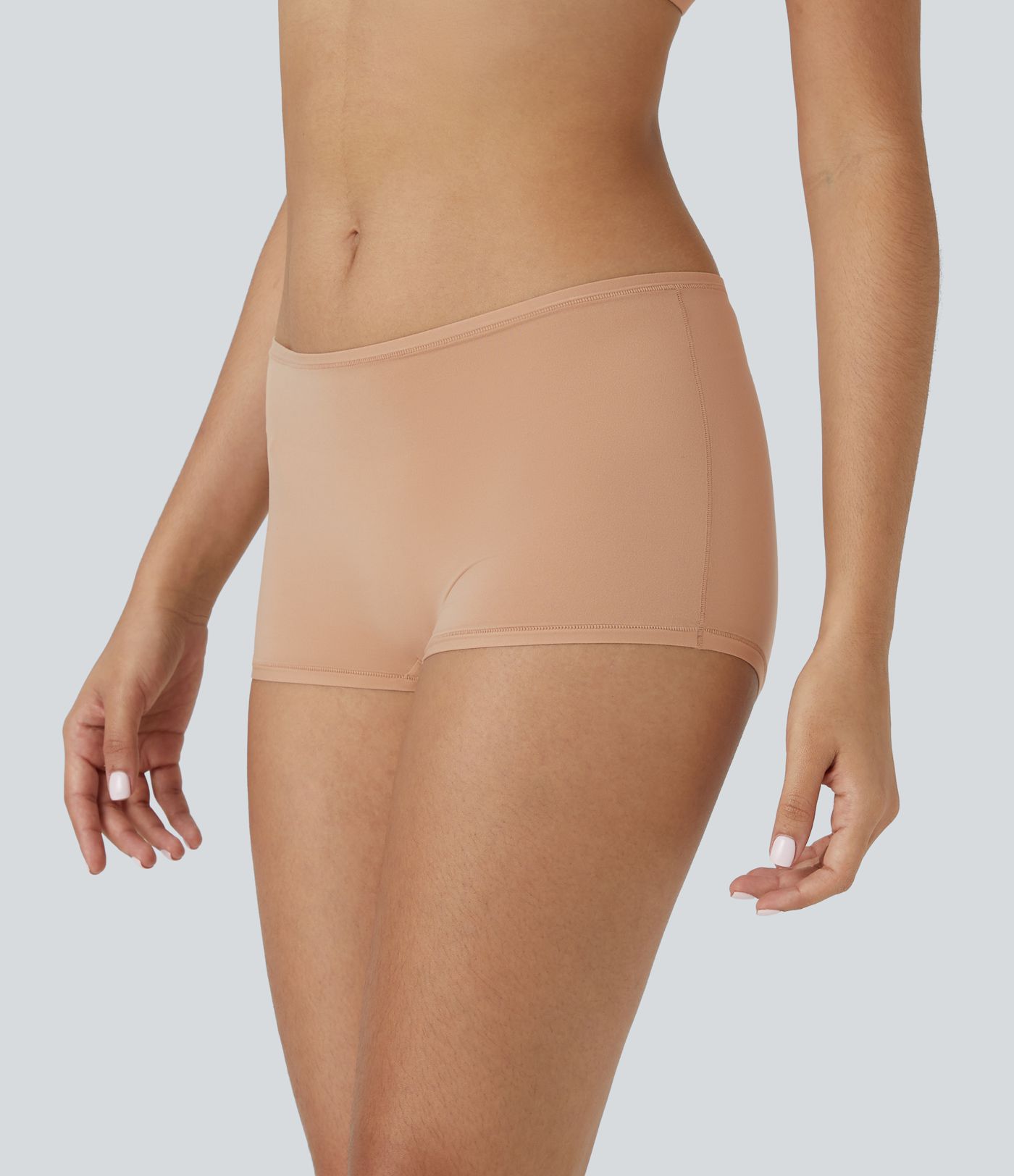 Short de détente garçon à taille basse et grande extensibilité uni