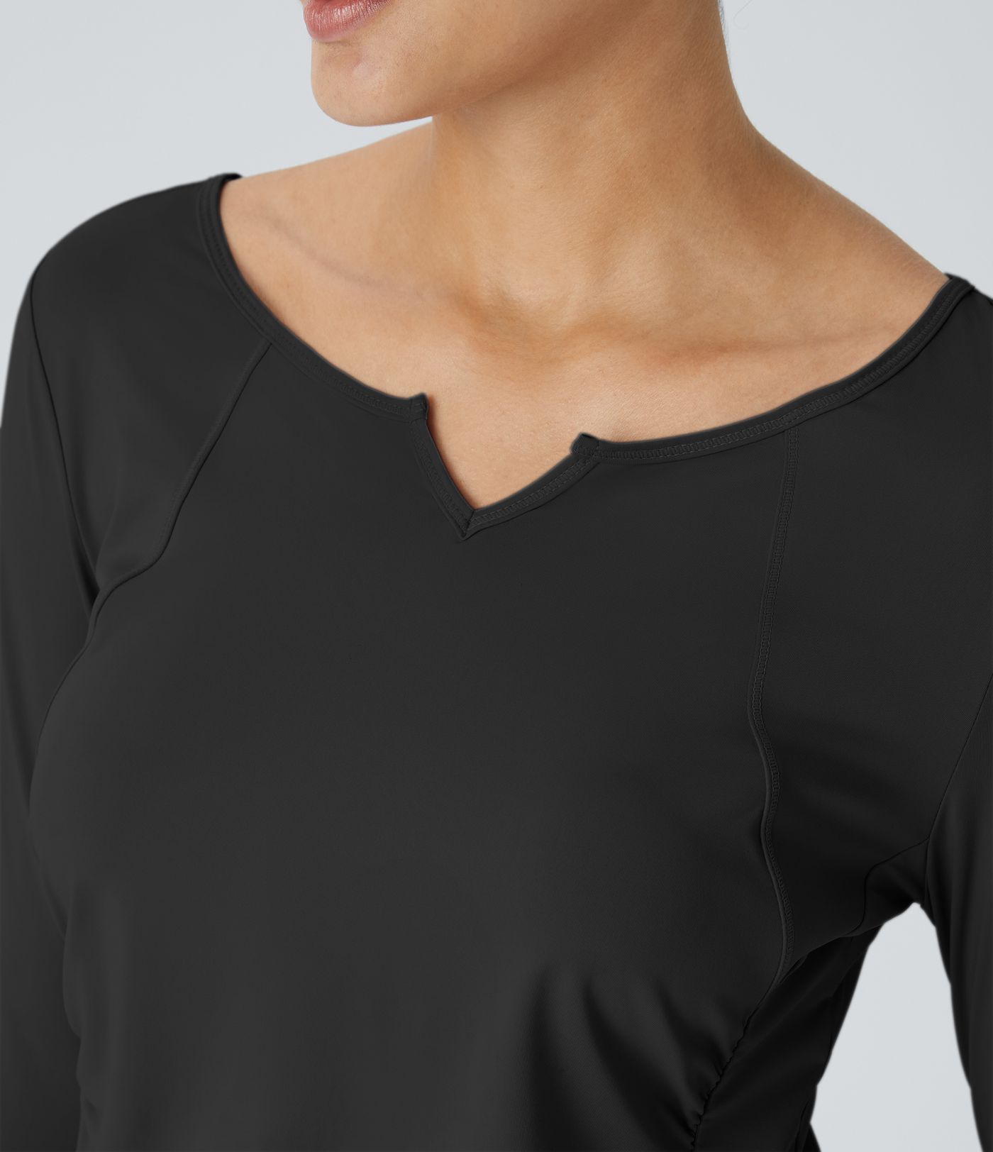 Notch collar thumb hole ruched detailing curved hem yoga sports top