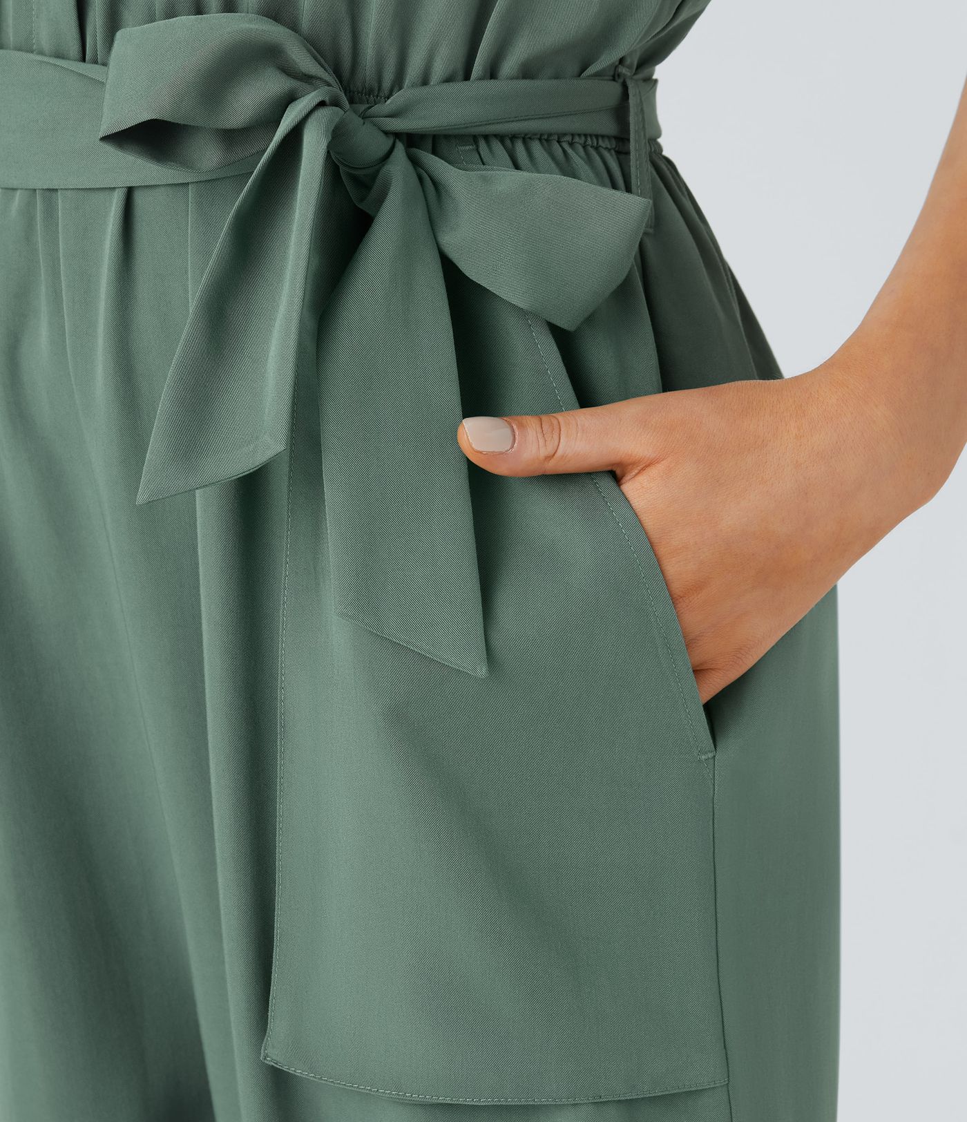 Mono capri bolsillo lateral cinturón cremallera sin mangas cuello V