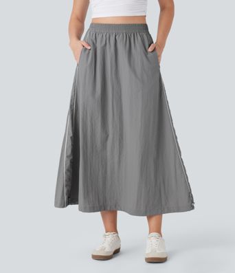 Jupe mi‑longue taille haute, color‑block et à rayures, ourlet ajustable, coupe A, style décontracté, avec poches.
