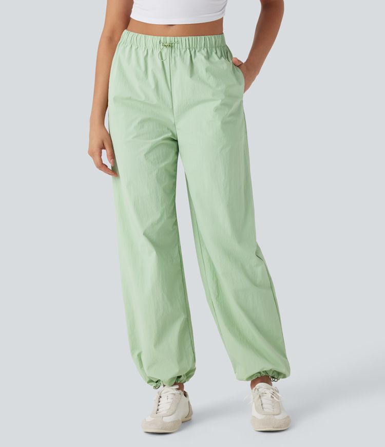 Pantalones deportivos de yoga de tiro bajo con dobladillo ajustable y bolsillos