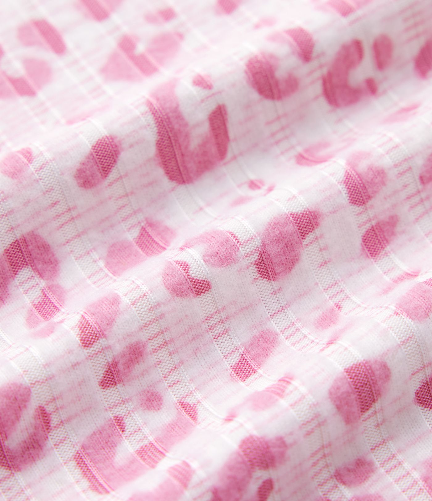 Volné tílko s výstřihem do V s leopardím vzorem a asymetrickým střihem