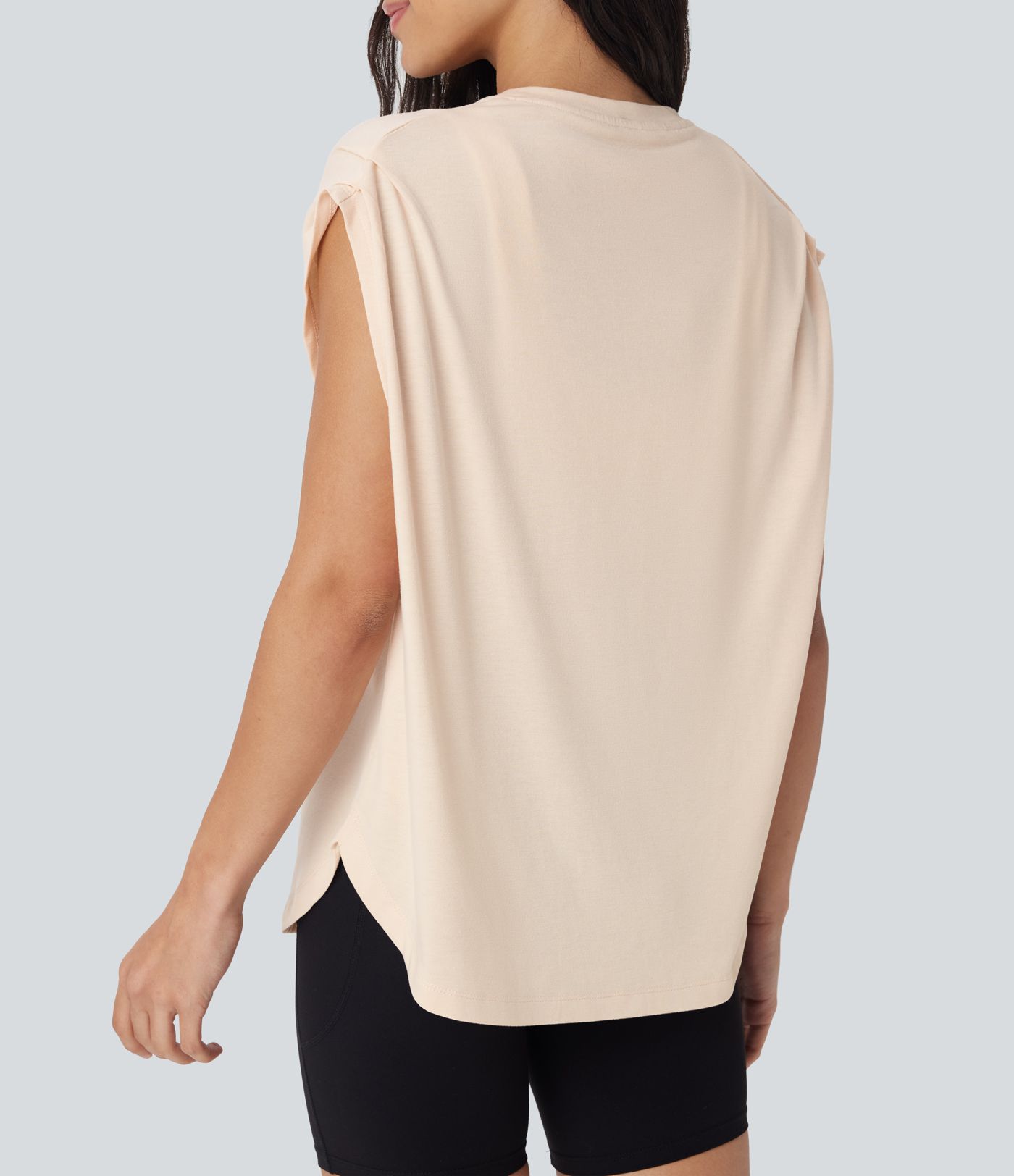 Top deportivo de yoga con hombros caídos y dobladillo curvo