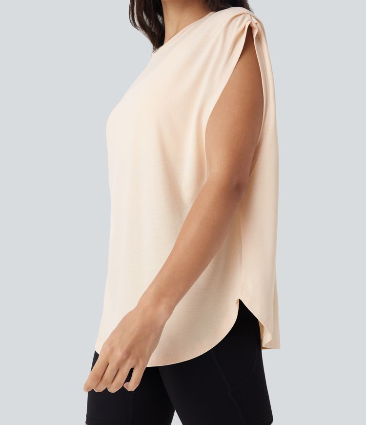 Top deportivo de yoga con hombros caídos y dobladillo curvo