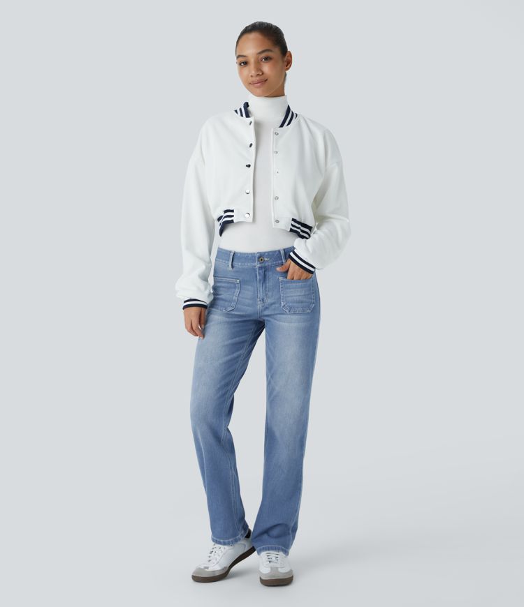 Jean décontracté délavé taille basse en maille extensible, coupe droite avec poches avant et fermeture zippée