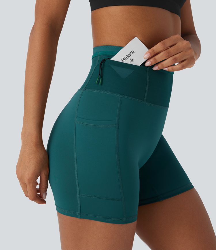 Shorts tipo biker de running SpeedWave™ de tiro alto moldeador abdominal  con malla de contraste y de secado rápido en longitud 12,7cm y bolsillos 360°