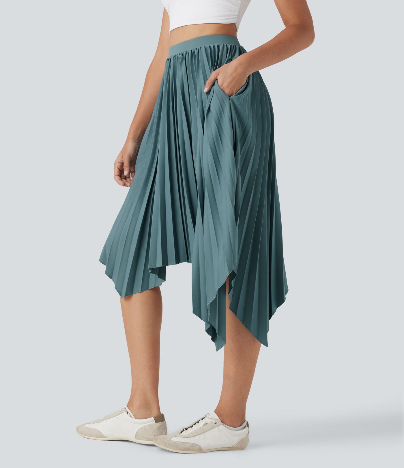 Falda casualplisada de cintura alta con dobladillo asimétrico y bolsillos