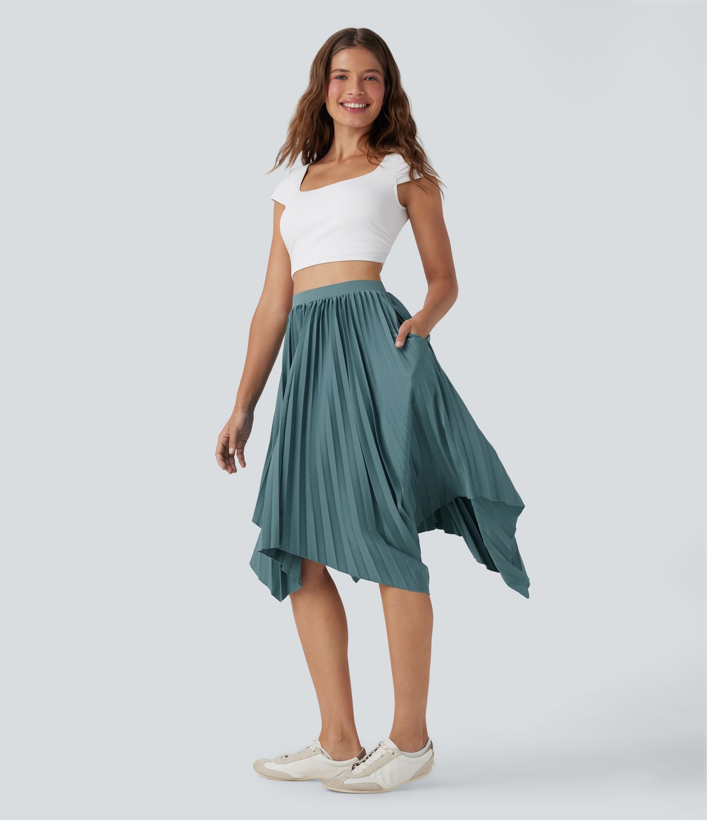 Falda casualplisada de cintura alta con dobladillo asimétrico y bolsillos