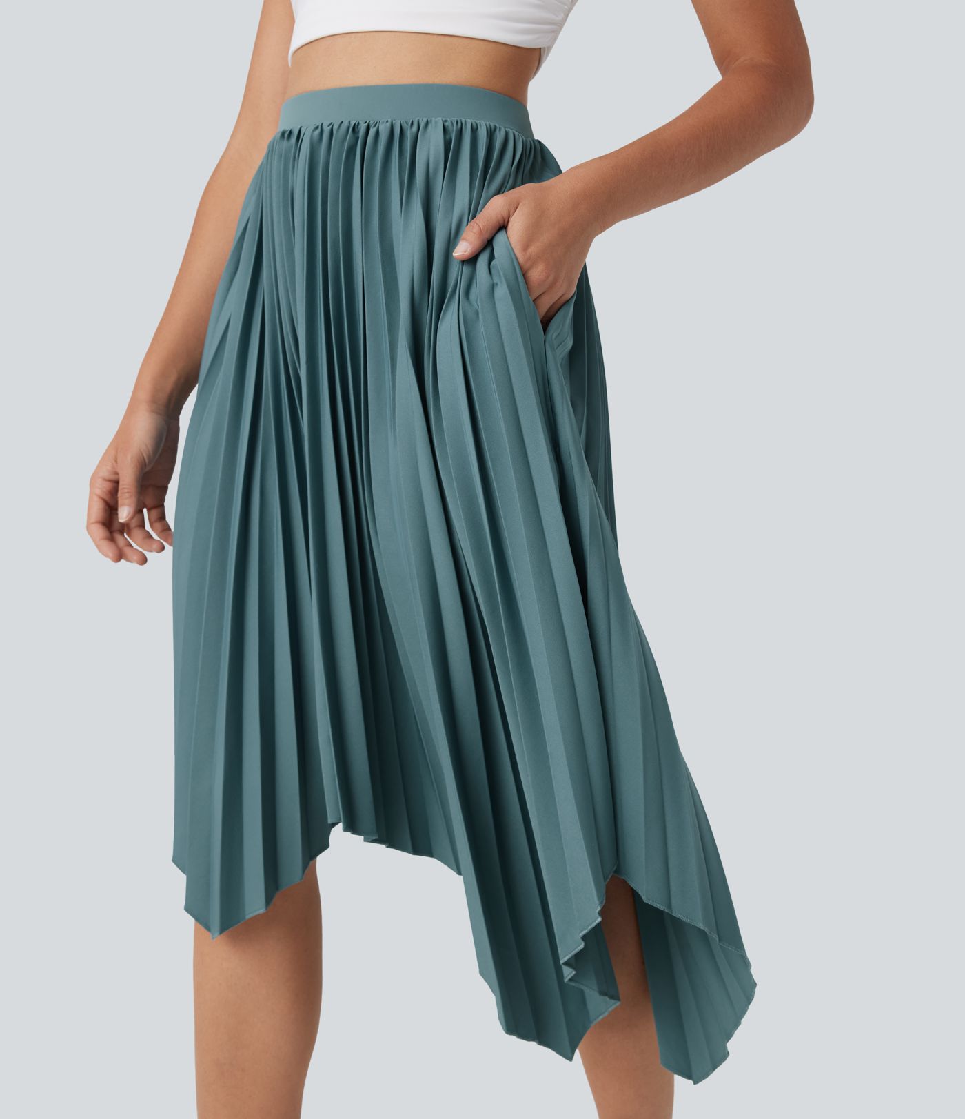 Falda casualplisada de cintura alta con dobladillo asimétrico y bolsillos