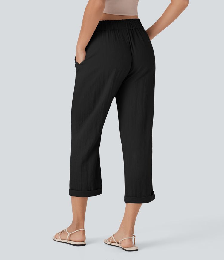 Stredne vysoké voľnočasové nohavice so zúženým strihom, so šnúrkami a vreckami