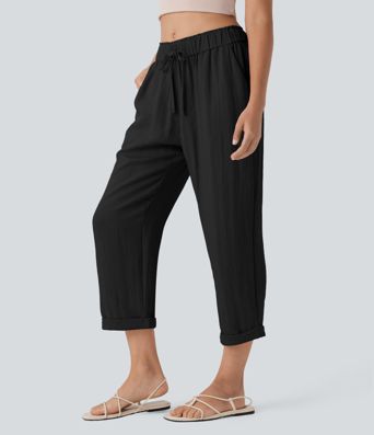 Stredne vysoké voľnočasové nohavice so zúženým strihom, so šnúrkami a vreckami