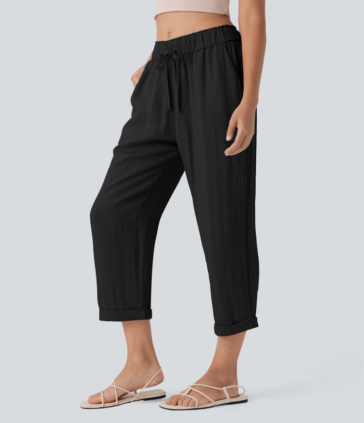 Stredne vysoké voľnočasové nohavice so zúženým strihom, so šnúrkami a vreckami