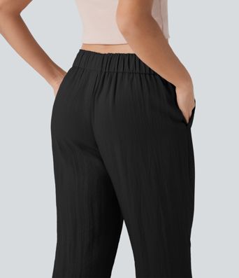 Stredne vysoké voľnočasové nohavice so zúženým strihom, so šnúrkami a vreckami