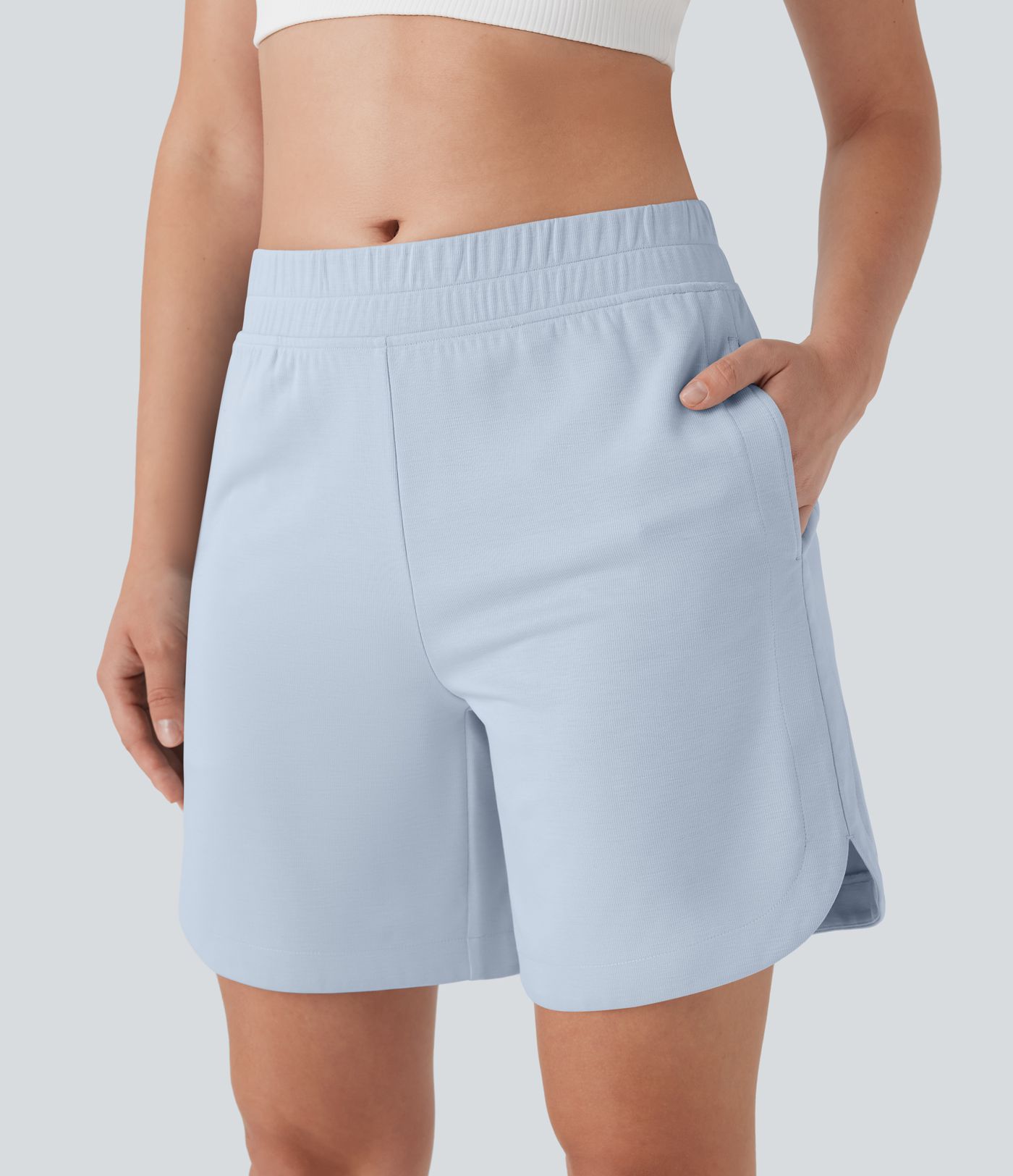 Bermudas de yoga con cintura media, bolsillos laterales y dobladillo curvo