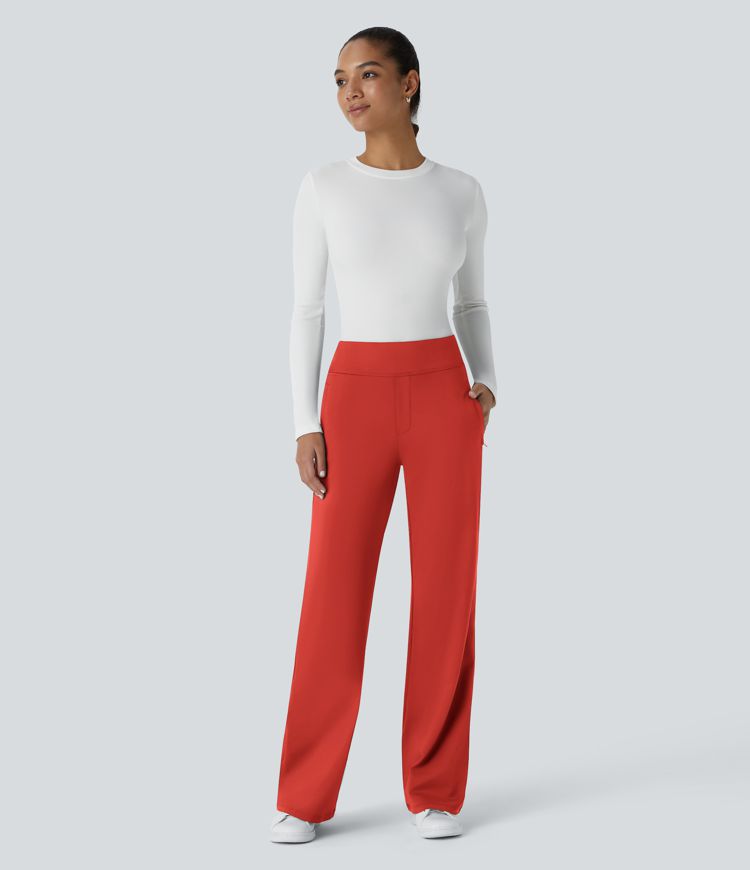 Pantalon Tailleur évasé  à taille haute et poches latérales zippées