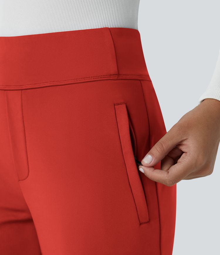 Pantalon Tailleur évasé  à taille haute et poches latérales zippées