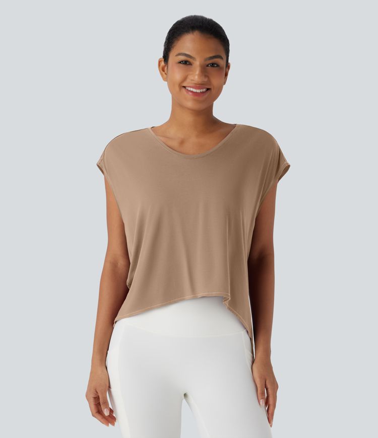 Top deportivo para running asimétrico con espalda cruzada y dobladillo asimétrico