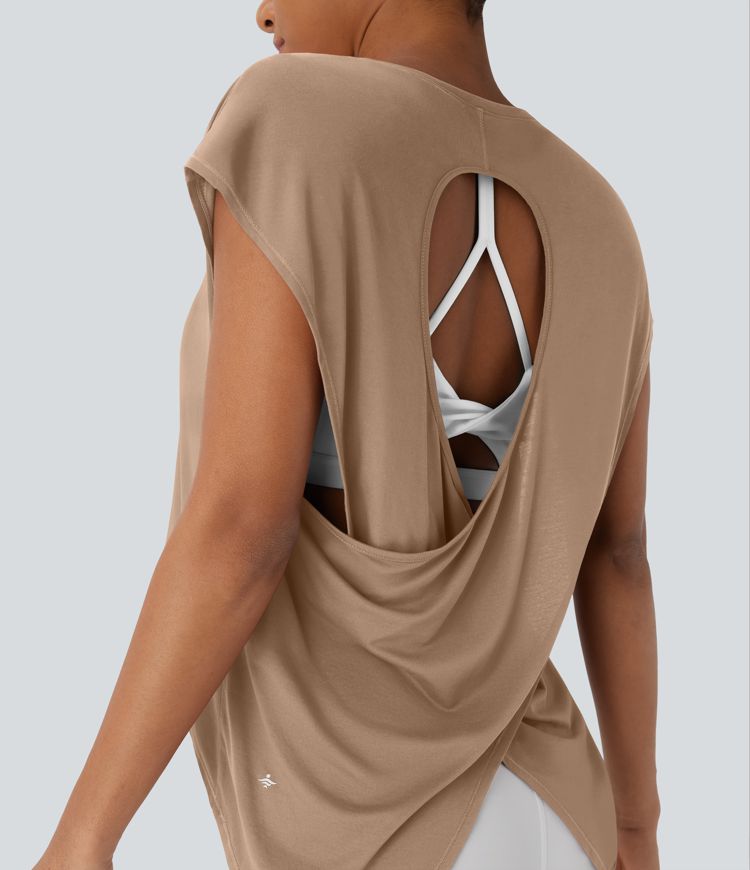 Top deportivo para running asimétrico con espalda cruzada y dobladillo asimétrico